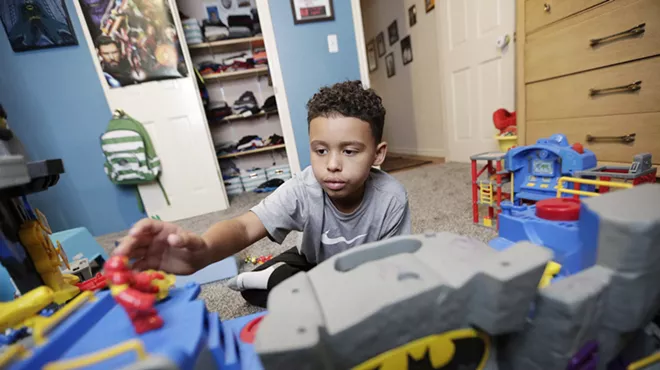 Image: Separated by Drugs: For a 7-year-old boy who lost his parents, signs of trauma linger as he embarks on a new life