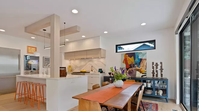 Image: A light-filled contemporary home provides the perfect backdrop for a couple's colorful collections