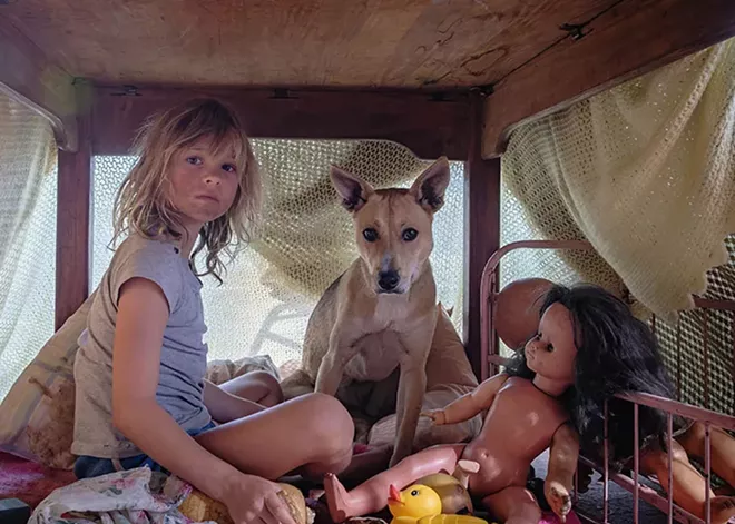 A memoir of an African upbringing in turbulent times comes to life in Don't Let's Go to the Dogs Tonight
