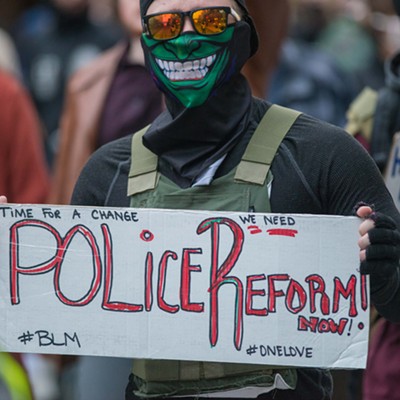 Image: As thousands march for more police accountability, a proposed Spokane Police contract could result in less