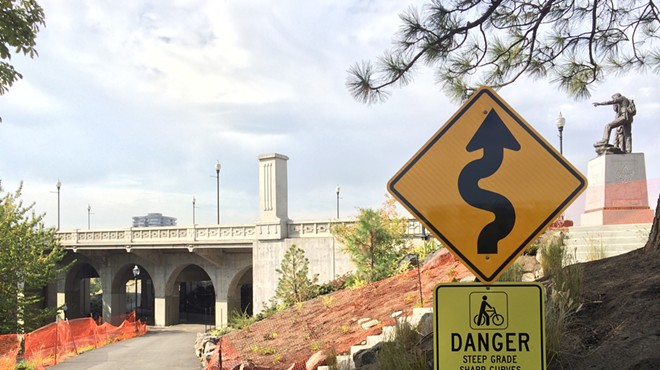 New signs warn of Centennial Trail curve under Monroe St. bridge