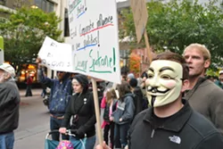 Occupy Spokane takes to the streets, goes to the bank