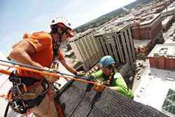 OVER THE EDGE: Rappelling down 264 feet