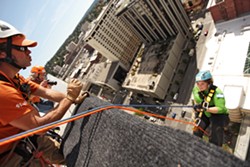 OVER THE EDGE: Rappelling down 264 feet