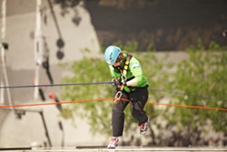 OVER THE EDGE: Rappelling down 264 feet