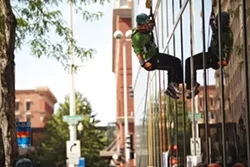 OVER THE EDGE: Rappelling down 264 feet