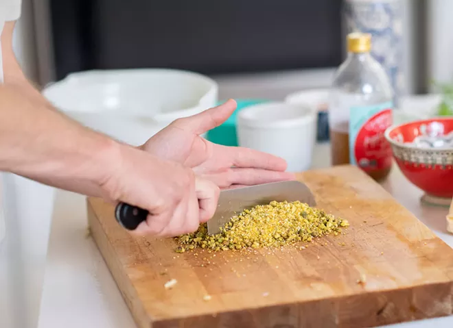 Image: Pistachio Halibut with Smoked Tomatoes and Corn Salad