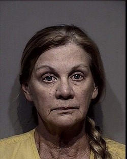 A North Idaho woman's husband is dead, and she is on the lam, wanted for alleged embezzlement