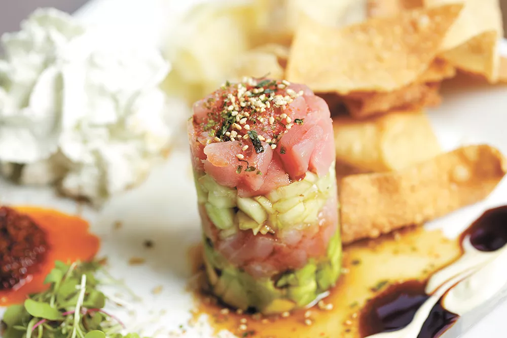 Tall Order: 1898 Public House's Tyler Schwenk uses an unusual technique to plate his ahi poke tuna