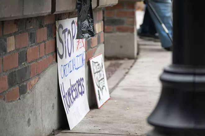 Activists form 'wall' to protect belongings of homeless outside City Hall