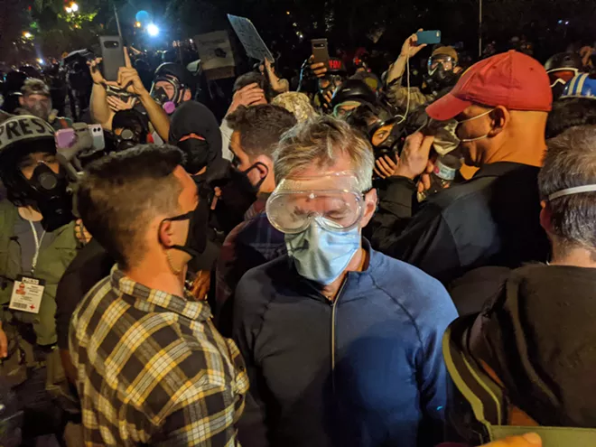 Federal officers hit Portland mayor with tear gas