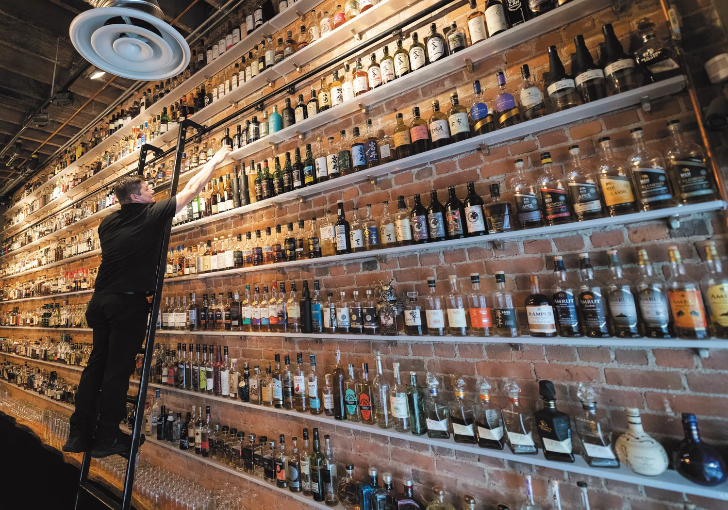 Whet your whistle with one of a thousand whiskeys at Purgatory Whiskey Bar
